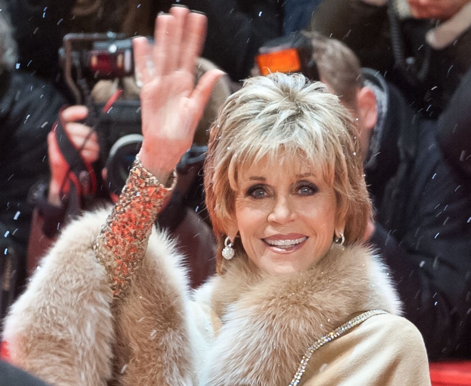 Activist and actress Jane Fonda waving from the red carpet