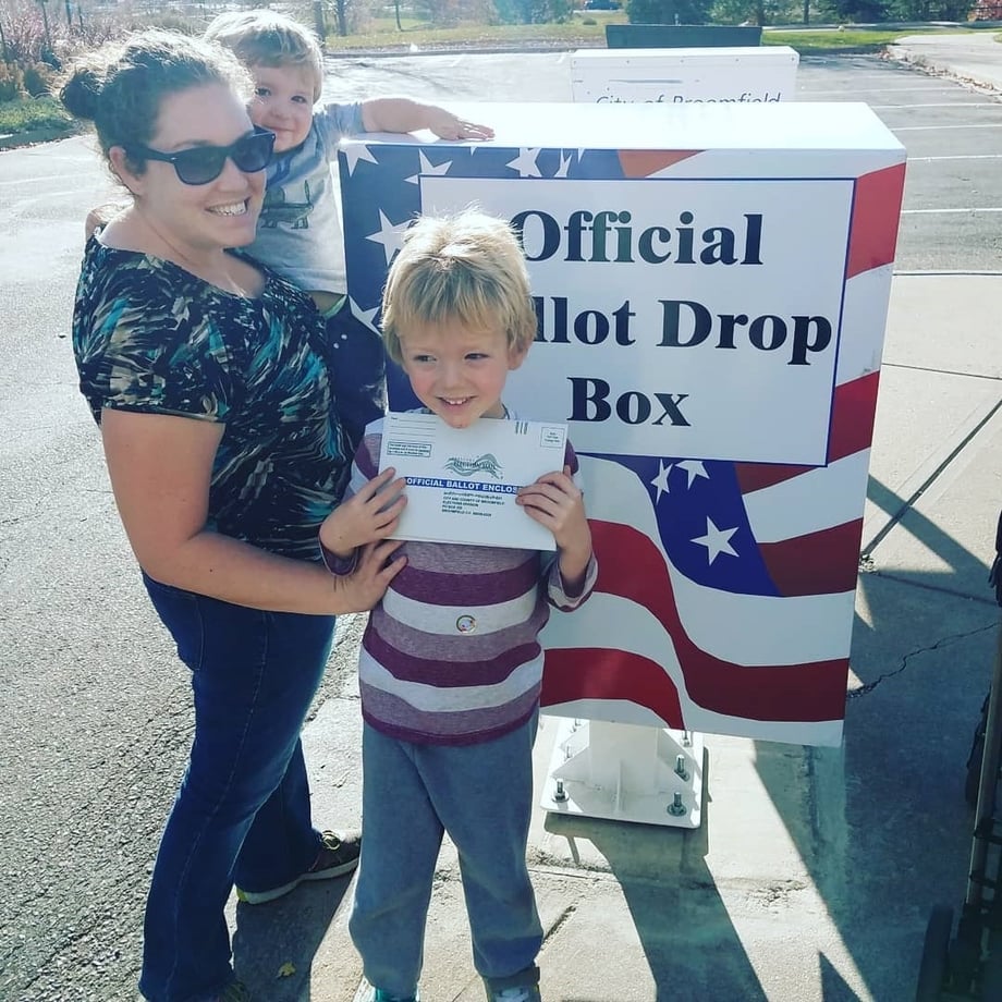 LWV employee Megan Brown with her children at an official ballot drop box